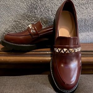 JF, brown loafers with silver spiked accents